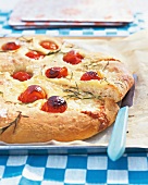 Tomato focaccia on baking tray