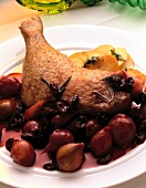 Close-up of braised duck leg on plate
