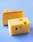 Close-up of harzer cheese and basket cheese on blue background
