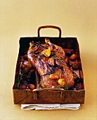 Crispy duck with a honey crust served with kumquats and figs
