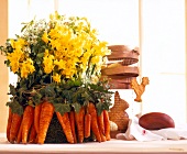 Bouquet of narcissus flowers with carrot and ivy wrapped on table