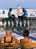 Women sitting on Fourviere hill overlooking city of Lyon in France