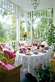 Set up of dining table in pink and white shades in garden