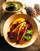 Tacos with kidney beans and guacamole in bowl