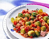 Microwave cooked brussels sprouts with smoked pork, tomatoes and mushrooms on dish