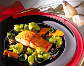 Euro-Asian cuisine of salmon fillet marinated in sake and teriyaki sauce on place setting