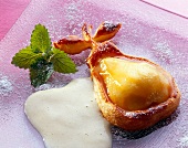 Close-up of pear with puff pastry and marzipan foam