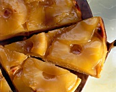 Close-up of glazed apple cake with jam in French style