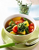 Vegetable soup in bowl with rocket pesto
