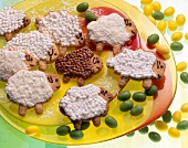 Easter cookies in the form of lambs on yellow plates
