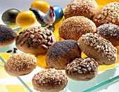 Egg in shape of crispy rolls with nuts and chicken figure with gold and blue eggs