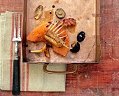 Saddle of rabbit on pumpkin with chestnuts and pfifferlingen in tray