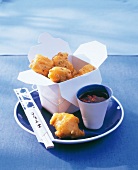 Asian style fried ginger chicken in box served with dip