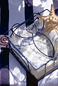 Napkins with fish motif in blue wire basket