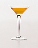 Sweet kiss cocktail in martini glass on white background