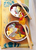 Turmeric jelly with mackerel on spoon and in bowl