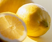 Close-up of whole and slice of lemon