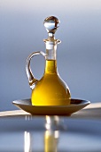Glass decanter containing olive oil
