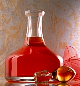 Strawberry liqueur made of vodka, strawberries and lime in bulbous glass bottle