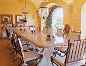 Long dining table with lamp in dining area - southern style