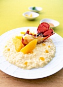 Risotto with orange mustard and lobster on plate