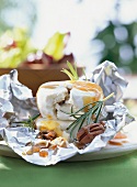 Fresh goat cheese with chestnut honey and pecans for barbecue