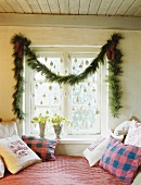 Room window with garland and tree decoration for Christmas