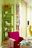 Green shelves on wall with crockery