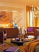 Interiors of living room with glass chandelier, brown armchairs and table