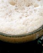 Close-up of beer foam