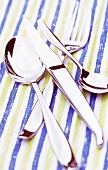 Close-up of cutlery on tablecloth