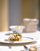 Fried zander with crust on leeks with celery foam on plate