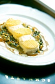 Close-up of char fillet with lentils on plate