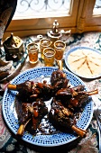Moroccan lamb dish on plate, overhead view
