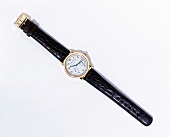 Close-up of wrist watch on white background