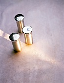 Three stainless steel shakers