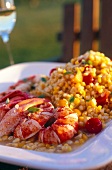 Close-up of lobster with corn in serving dish