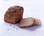 Close-up of half peasant bread with four slices