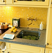 Nostalgic sink with brass fittings and mosaic tiles