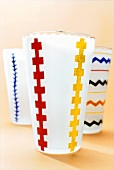 Close-up of water and juice glasses with muilt-coloured pattern