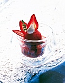 Strawberry cappuccino with strawberry sorbet garnished with strawberry and thyme in glass