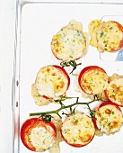 Close-up of baked tomatoes with panicles in serving dish