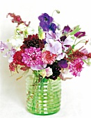 Bouquet of colourful flowers in glass vase