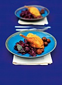 Capon on dressing of red cabbage and chestnuts on plate
