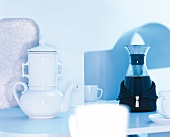 White pot and coffee pot with wet suit