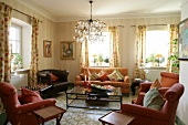 Interior of living room with sofa, table and chandelier in hotel