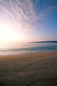 Propriano beach with forested coast in Corsica, France