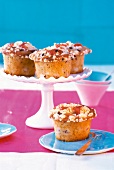 Rhubarb-Almond muffins on cake stand and one on plate