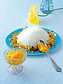 Quark cream with mango compote on blue plate
