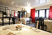 Interior of restaurant with dining tables, Germany